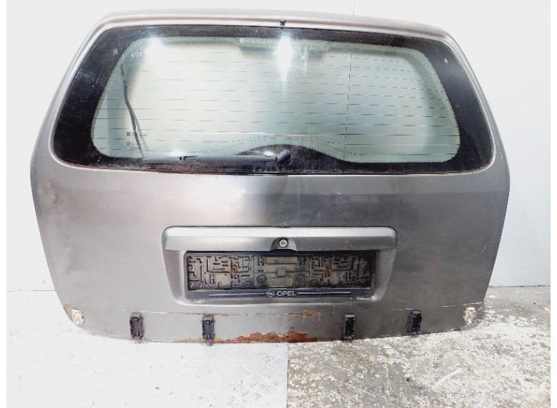 Накладка подсветки номера к Opel Astra, 1998г.