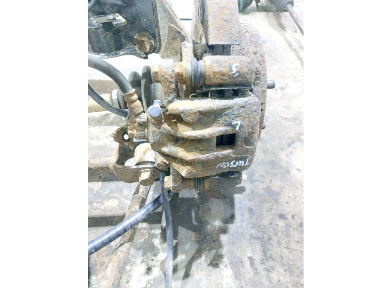 Суппорт задний левый к Hyundai Tucson, 2008г.