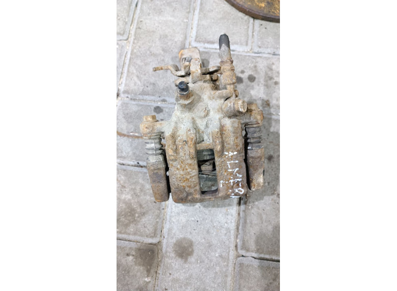 Суппорт задний левый к Nissan Almera