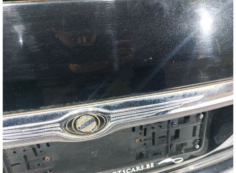 Накладка подсветки номера к Chrysler Grand Voyager, 2005г.