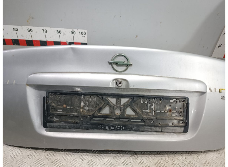 Накладка подсветки номера к Opel Vectra, 1998г.