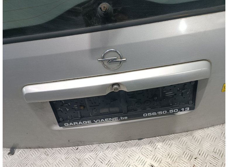 Накладка подсветки номера к Opel Astra, 2000г.