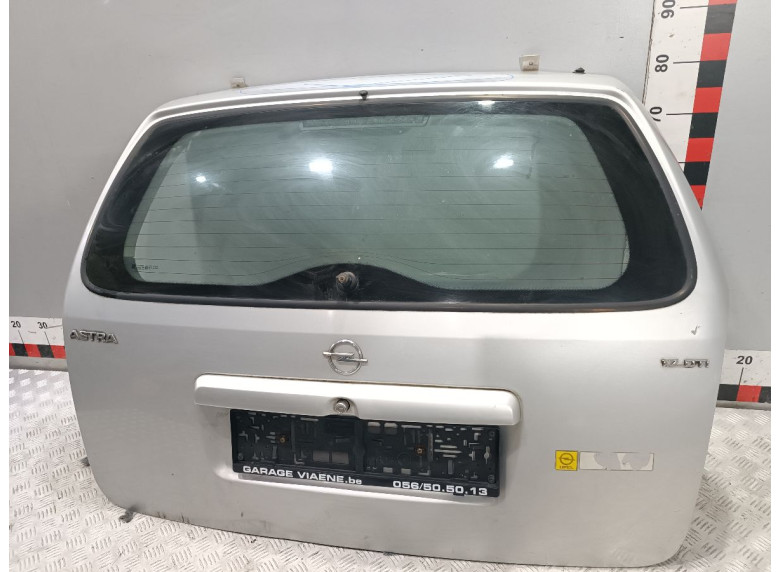 Накладка подсветки номера к Opel Astra, 2000г.