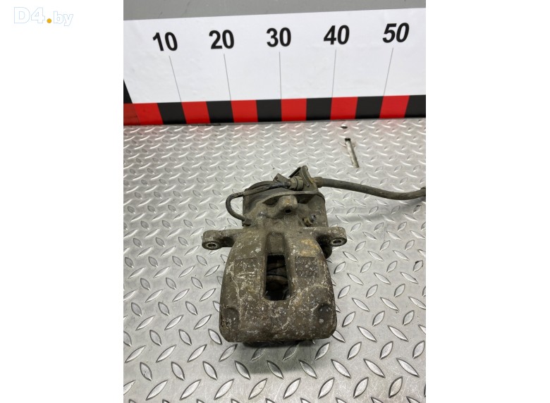 Суппорт задний левый к Volkswagen Passat undefined г.