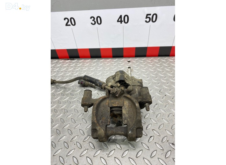 Суппорт задний левый к Volkswagen Passat undefined г.