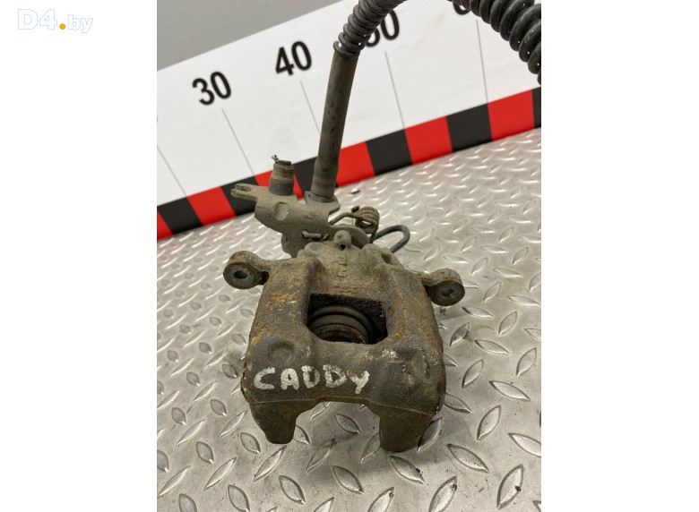 Суппорт задний левый к Volkswagen Caddy undefined г.