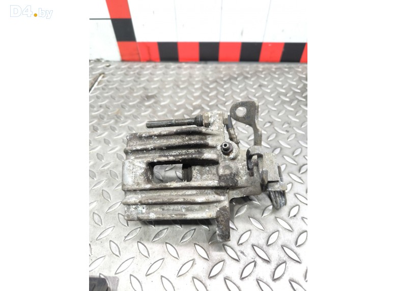 Суппорт задний левый к Volkswagen Passat undefined г.