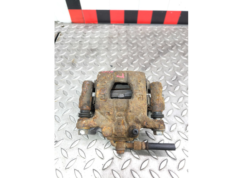 Суппорт задний левый к Nissan Tiida