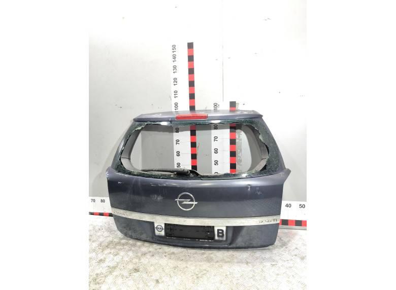 Накладка подсветки номера к Opel Astra, 2005г.