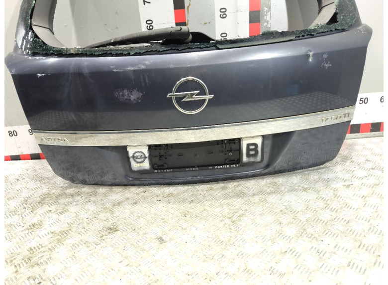 Накладка подсветки номера к Opel Astra, 2005г.