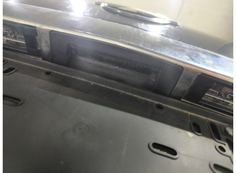 Накладка подсветки номера к Opel Astra, 2005г.