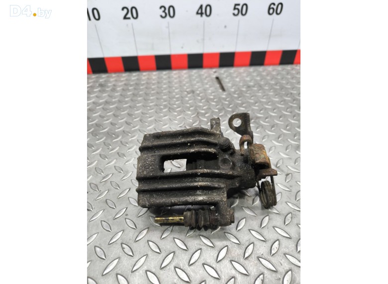 Суппорт задний левый к Volkswagen Passat undefined г.