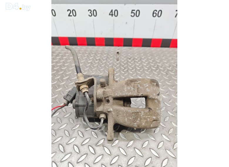 Суппорт задний левый к Volkswagen Passat undefined г.