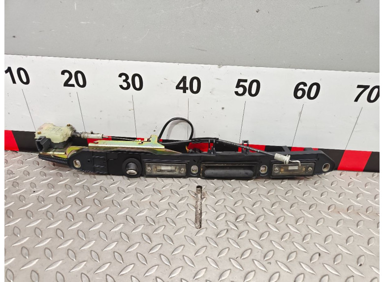 Накладка подсветки номера к Volkswagen Passat, 2002г.