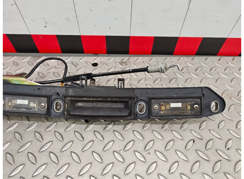 Накладка подсветки номера к Volkswagen Passat, 2002г.