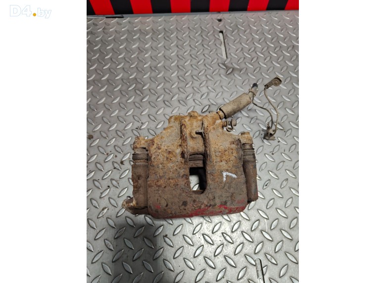 Суппорт передний левый к Renault Laguna 1997 г.