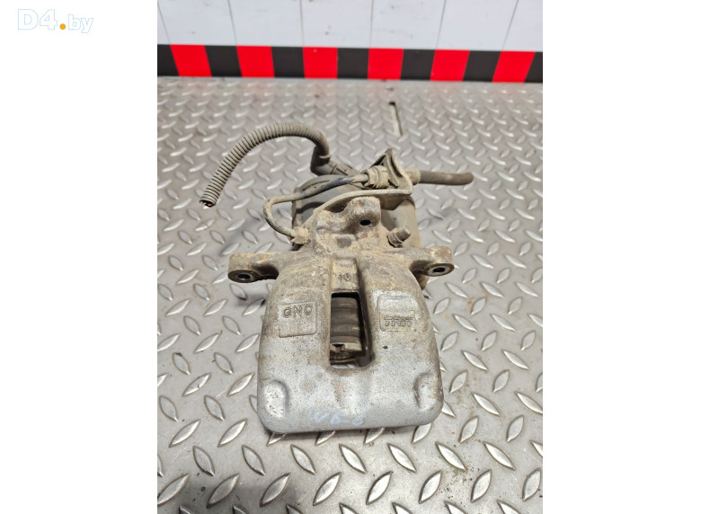 Суппорт задний левый к Volkswagen Passat 2006 г.