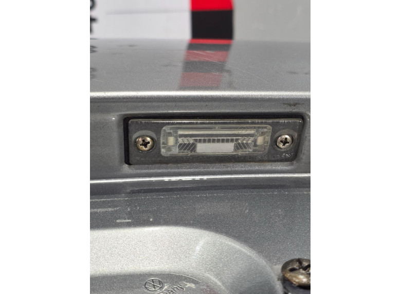 Накладка подсветки номера к Volkswagen Passat, 2002г.