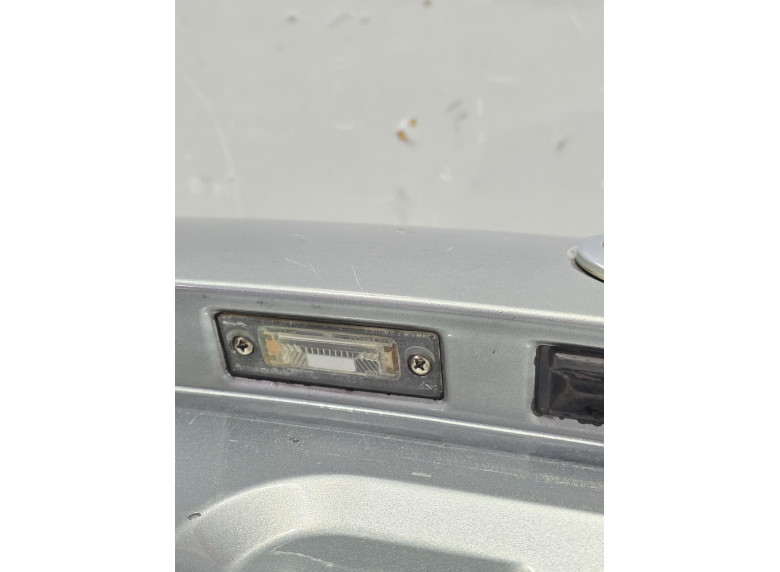 Накладка подсветки номера к Volkswagen Passat, 2002г.