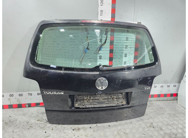 Накладка подсветки номера к Volkswagen Touran, 2005г.