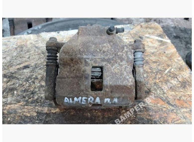 Суппорт передний левый к Nissan Almera, 2001г.