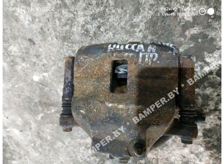 Суппорт передний правый к Nissan Primera