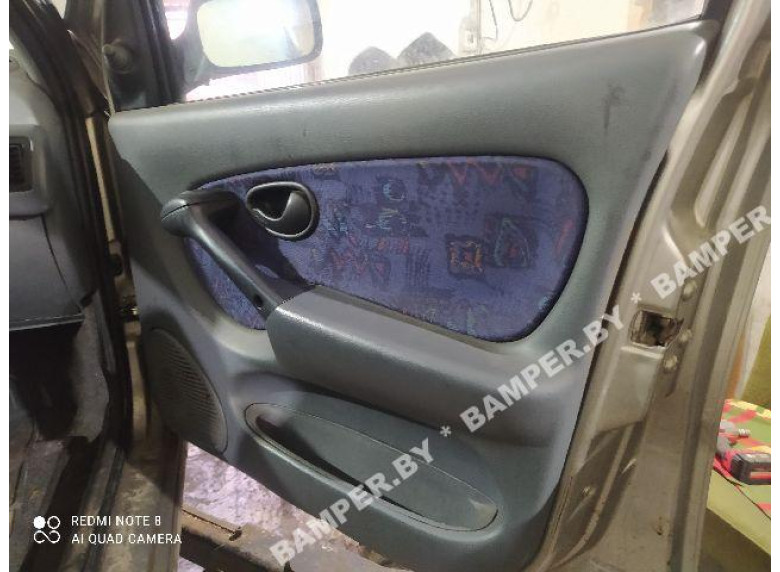 Обшивка двери (дверная карта) комплект к Fiat Palio, 2001г.