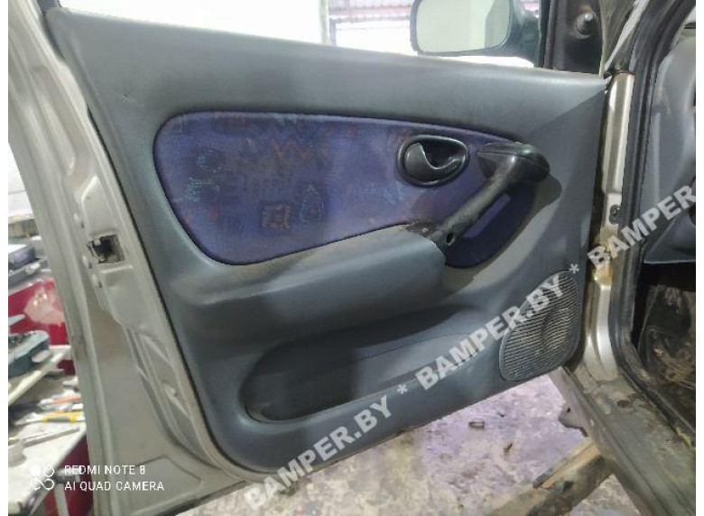 Обшивка двери (дверная карта) комплект к Fiat Palio, 2001г.