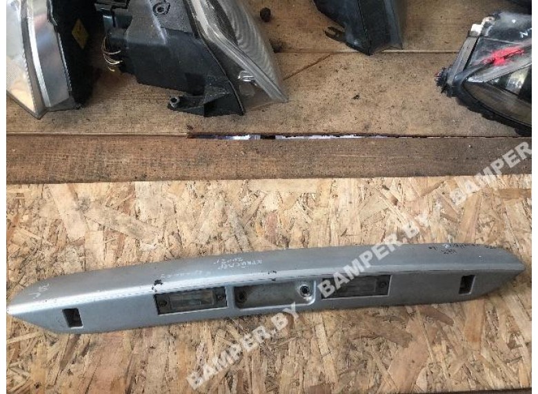 Накладка подсветки номера к Chrysler Voyager