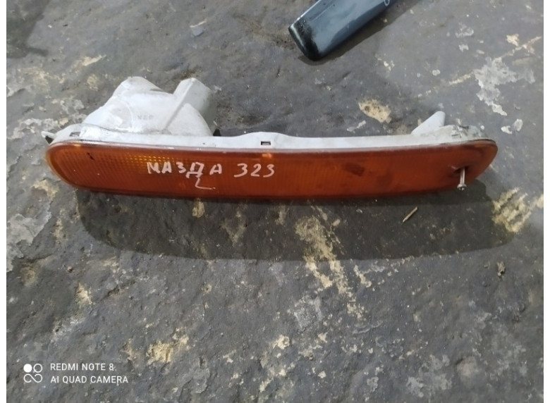Поворотник левый к Mazda 323, 2002г.