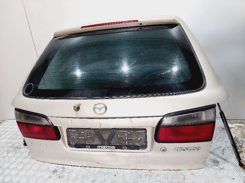 Замок багажника - Mazda 626 (1997-2001)